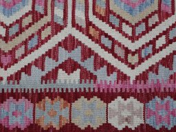 Backside of handmade New Modern Design rug showing knot structure and weave density