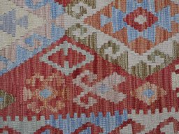 Backside of handmade New Modern Design rug showing knot structure and weave density