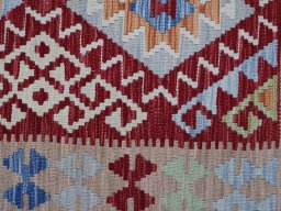 Backside of handmade New Modern Design rug showing knot structure and weave density