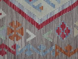 Backside of handmade New Modern Design rug showing knot structure and weave density