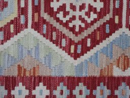 Backside of handmade New Modern Design rug showing knot structure and weave density