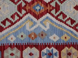 Backside of handmade New Modern Design rug showing knot structure and weave density