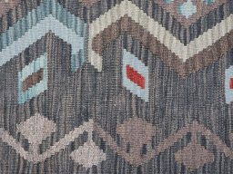 Backside of handmade New Modern Design rug showing knot structure and weave density
