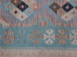 Backside of handmade New Modern Design rug showing knot structure and weave density