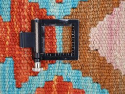 Corner detail of New Modern Design rug showing border pattern and Wool pile