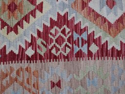 Backside of handmade New Modern Design rug showing knot structure and weave density
