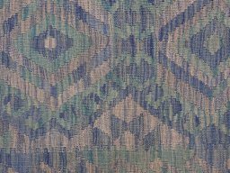 Backside of handmade New Modern Design rug showing knot structure and weave density