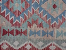 Backside of handmade New Modern Design rug showing knot structure and weave density