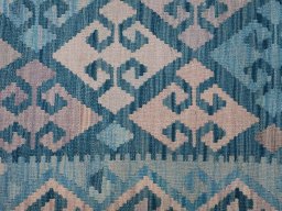 Backside of handmade New Modern Design rug showing knot structure and weave density
