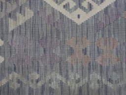 Backside of handmade New Modern Design rug showing knot structure and weave density