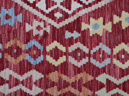 Backside of handmade New Modern Design rug showing knot structure and weave density