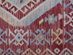 Backside of handmade New Modern Design rug showing knot structure and weave density