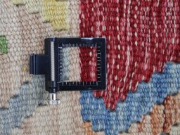 Corner detail of New Modern Design rug showing border pattern and Wool pile