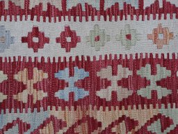 Backside of handmade New Modern Design rug showing knot structure and weave density