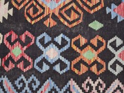 Backside of handmade New Modern Design rug showing knot structure and weave density