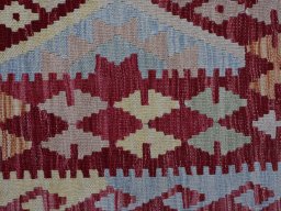 Backside of handmade New Modern Design rug showing knot structure and weave density