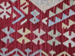 Backside of handmade New Modern Design rug showing knot structure and weave density