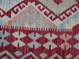 Backside of handmade New Modern Design rug showing knot structure and weave density