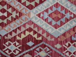 Backside of handmade New Modern Design rug showing knot structure and weave density
