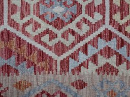 Backside of handmade New Modern Design rug showing knot structure and weave density