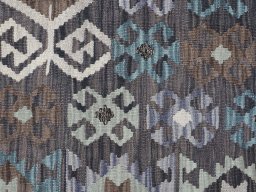 Backside of handmade New Modern Design rug showing knot structure and weave density