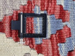 Corner detail of New Modern Design rug showing border pattern and Wool pile