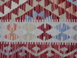 Backside of handmade New Modern Design rug showing knot structure and weave density