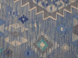 Backside of handmade New Modern Design rug showing knot structure and weave density