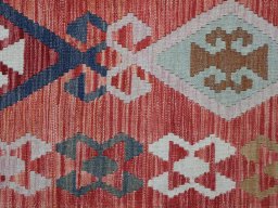 Backside of handmade New Modern Design rug showing knot structure and weave density
