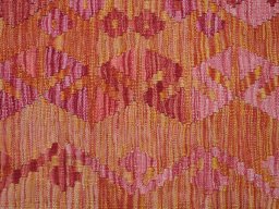 Backside of handmade New Modern Design rug showing knot structure and weave density