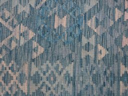 Backside of handmade New Modern Design rug showing knot structure and weave density