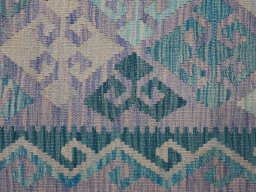 Backside of handmade New Modern Design rug showing knot structure and weave density