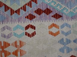 Backside of handmade New Modern Design rug showing knot structure and weave density