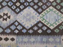 Backside of handmade New Modern Design rug showing knot structure and weave density