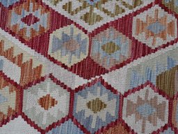 Backside of handmade New Modern Design rug showing knot structure and weave density