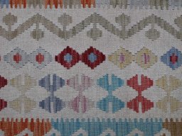 Backside of handmade New Modern Design rug showing knot structure and weave density