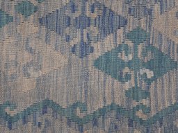 Backside of handmade New Modern Design rug showing knot structure and weave density