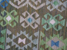Backside of handmade New Modern Design rug showing knot structure and weave density