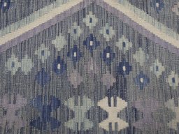 Backside of handmade New Modern Design rug showing knot structure and weave density
