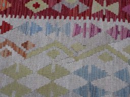 Backside of handmade New Modern Design rug showing knot structure and weave density