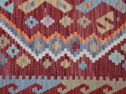 Backside of handmade New Modern Design rug showing knot structure and weave density