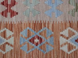 Backside of handmade New Modern Design rug showing knot structure and weave density