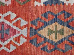 Backside of handmade New Modern Design rug showing knot structure and weave density