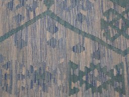 Backside of handmade New Modern Design rug showing knot structure and weave density