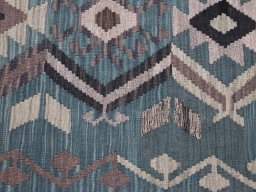 Backside of handmade New Modern Design rug showing knot structure and weave density