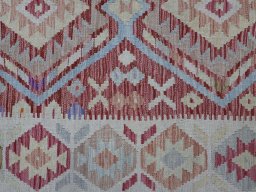 Backside of handmade New Modern Design rug showing knot structure and weave density