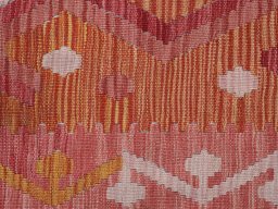 Backside of handmade New Modern Design rug showing knot structure and weave density
