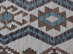Backside of handmade New Modern Design rug showing knot structure and weave density