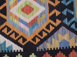 Backside of handmade New Modern Design rug showing knot structure and weave density