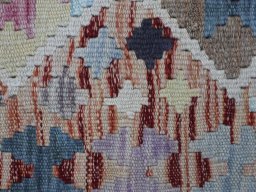 Backside of handmade New Modern Design rug showing knot structure and weave density